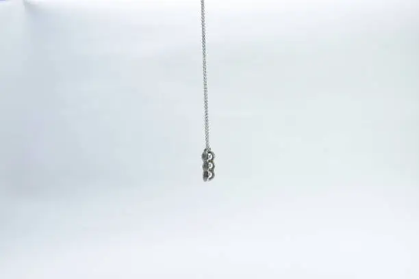 Pendant on silver chain isolated on white background