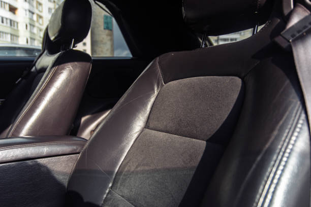istock leather black car interior with suede 1210183648