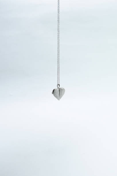 istock Pendant on silver chain isolated on white background 1210183718