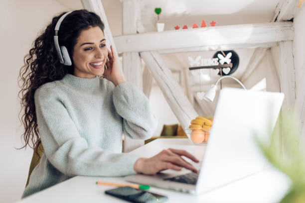 istock Beautiful young woman working online from her home office 1210183803