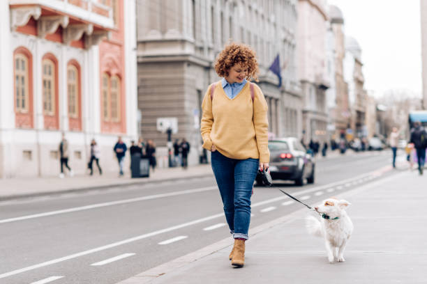 istock Girl walking her dog and enjoying 1210183839