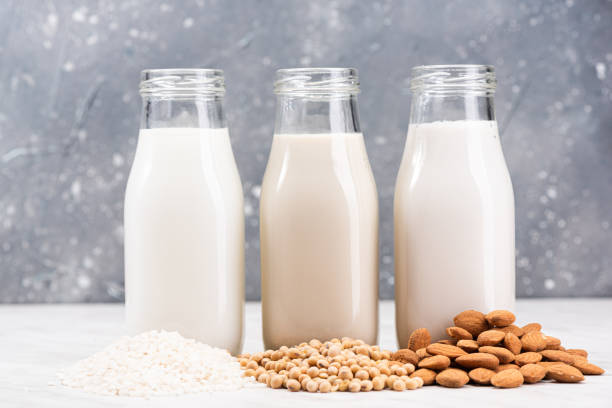 almond, soya and rice plant based milk. alternative non dairy helthy food. organic fresh milk - non gmo imagens e fotografias de stock