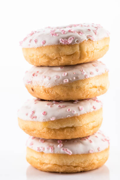 istock White Chocolate  Donut or Dougnut Tower on White Background 1210186706