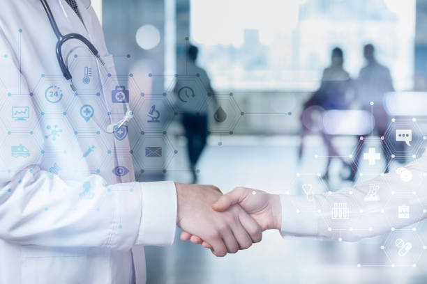 istock The doctor shakes hands with the patient . 1210186719