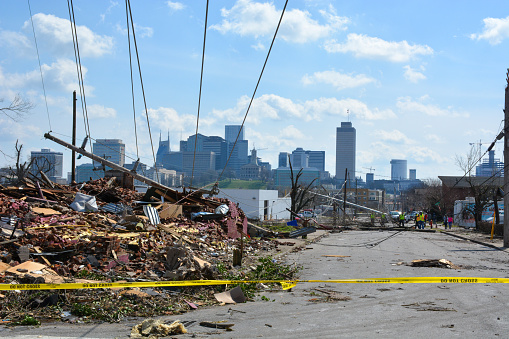 Nashville, Tennessee, 2020: The Nashville city skyline creates a backdrop to the tornado destruction in the nearby Buena Vista neighborhood.