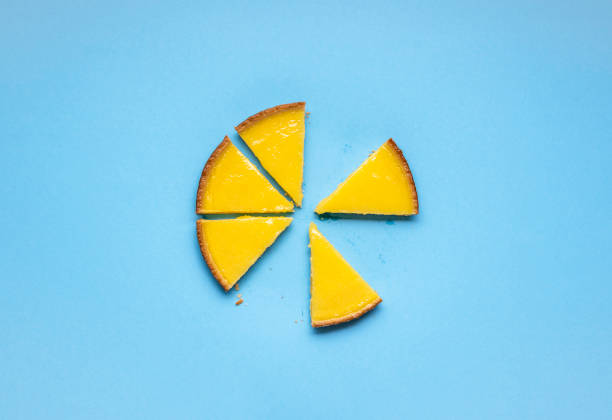istock Sliced lemon pie on blue background. Fruit tart slices 1210188430