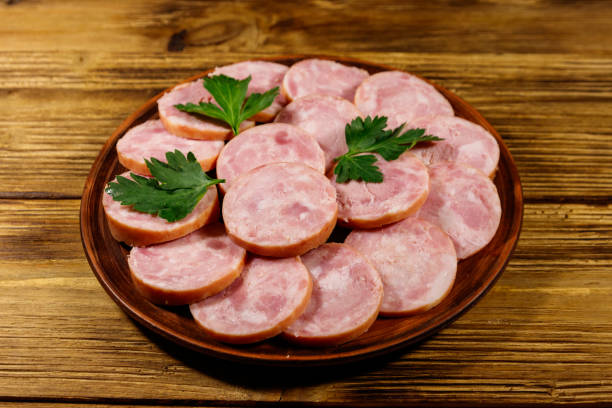 istock Ham sausage on a plate on wooden table 1210192095