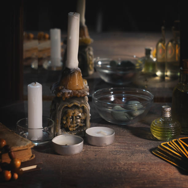 istock Magic concept. Burning candles and tincture bottles are reflected in old mirror 1210192332