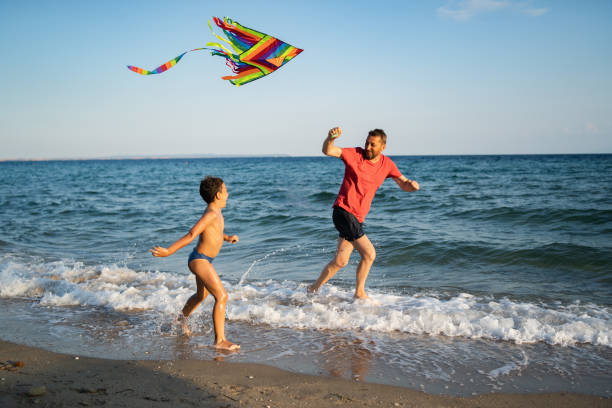 istock Father and son flying a kite 1210192553