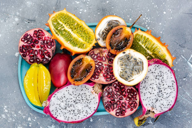 istock Tropical Exotic Fruits on Concrete Background, Top Down view 1210193948