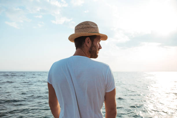 Young man looking into the sea horizon