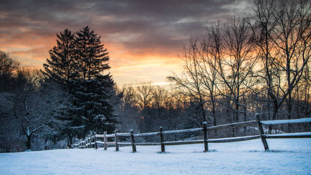 istock Sunrise on country road in winter 1210196082