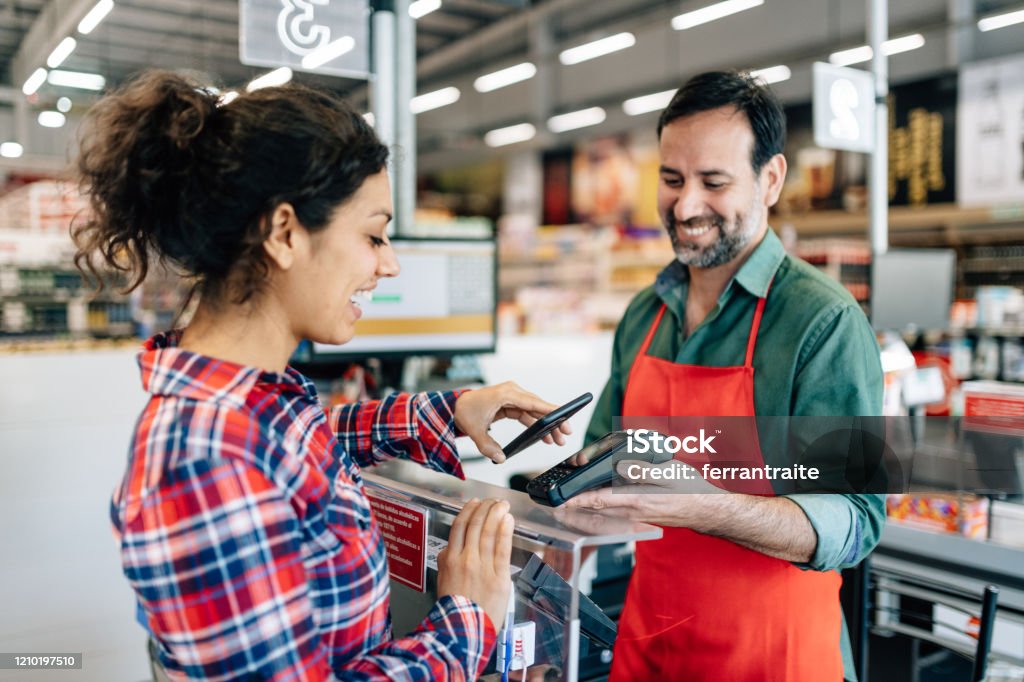 Supermarket Contactless Payment Contactless Payment at Supermarket checkout Paying Stock Photo
