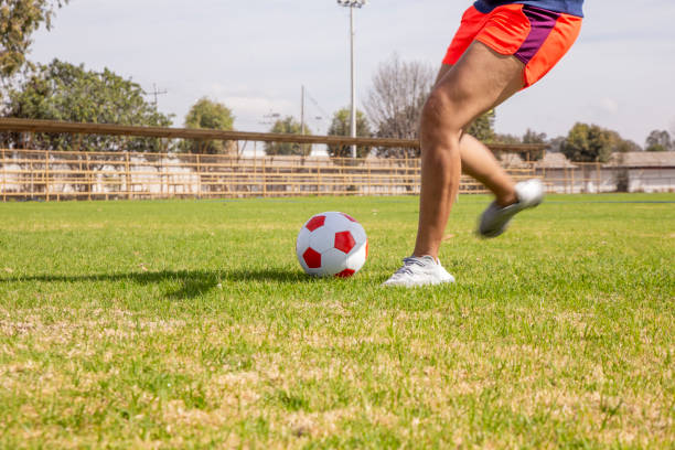 istock Young Latinos practicing football 1210201243