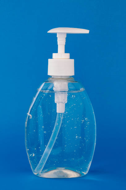 istock Hand sanitizer isolated on a blue background 1210201977