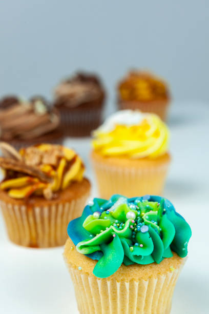 istock Delicious blue and green cupcake covered in sprinkles 1210205197