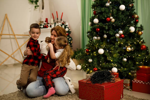 istock Mother's hugs for everyone during Christmas decorations 1210208981