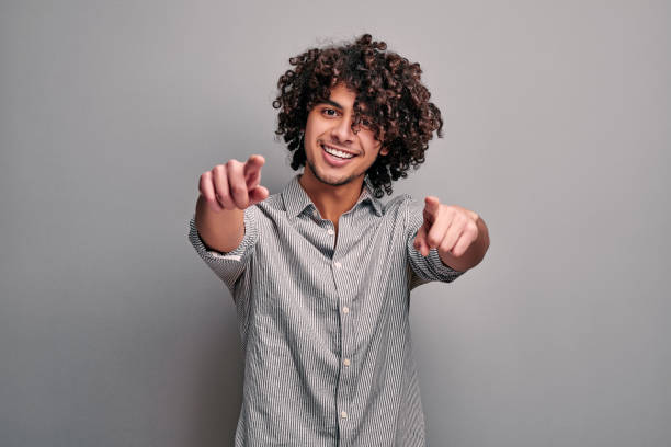 Joyful Indian Boy Friendly Smiling And Gesturing At Camera Stock Photo - Download Image Now - iStock Joyful Indian Boy Friendly Smiling And Gesturing At Camera Stock Photo - Download Image Now - iStock