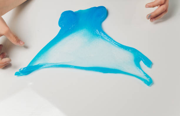 istock Kid Playing Hand Made Toy Called Slime Alien drool Shell mussel. 1210216855
