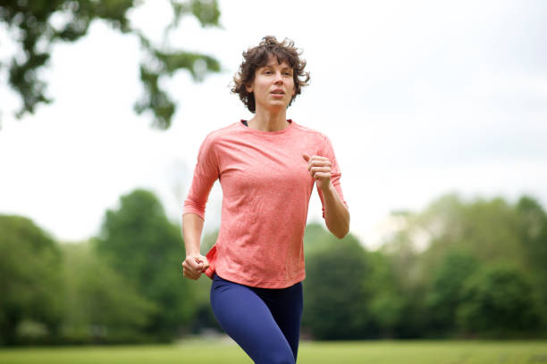 istock active woman running in park 1210217307