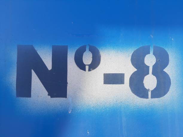 istock Stencil number eight, spray stencil on metal, blue painted 1210218067
