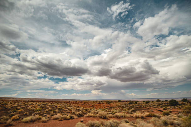 View Of Monument Valley Navajo Tribal Park Against Cloudy Sky