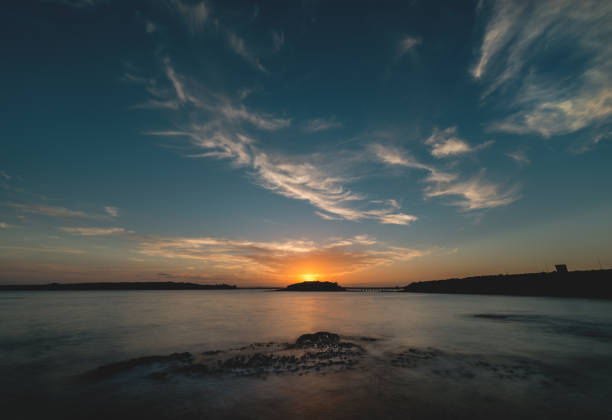 istock Sunset at Botany Bay overlooking silhouette of Bare Island 1210222967