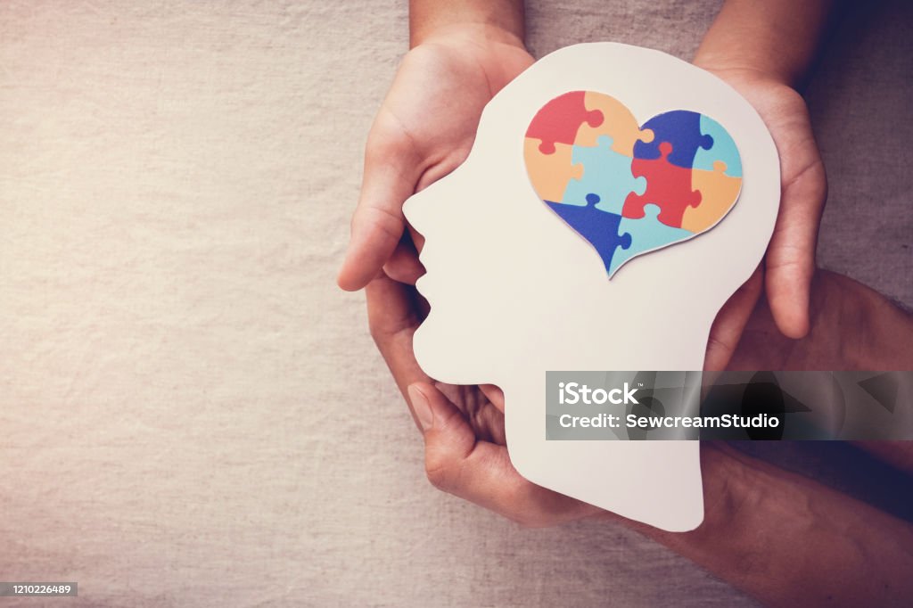 puzzle jigsaw heart on brain,  mental health concept, world autism awareness day Mental Health Stock Photo