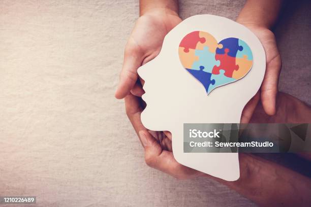 Puzzle Jigsaw Heart On Brain Mental Health Concept World Autism Awareness Day Stock Photo - Download Image Now
