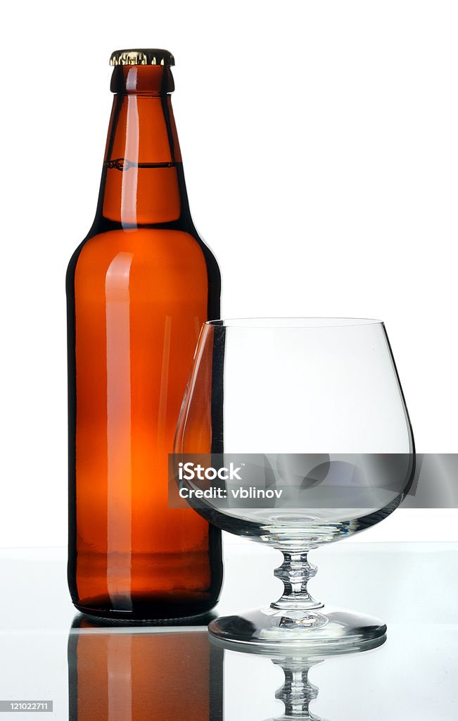 Bottle of beer and glass, isolated  Alcohol - Drink Stock Photo