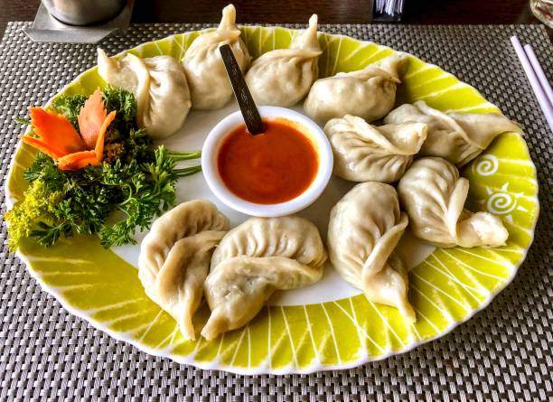Vegetarian momo Steamed momo with cabbage used as filling a. chinese dumpling stock pictures, royalty-free photos & images