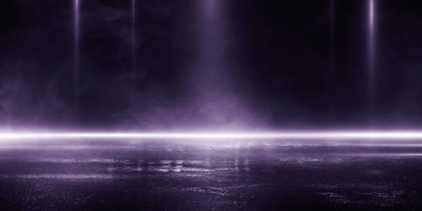 istock 3D rendering abstract dark empty scene blue neon searchlight light wet asphalt smoke night view rays. 1210230628