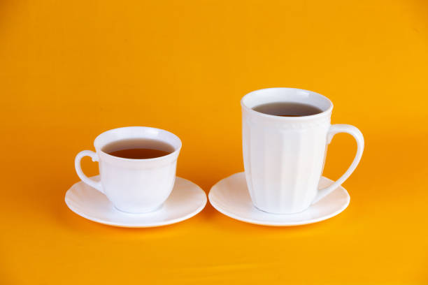 istock Pair of white cups of coffee 1210230881