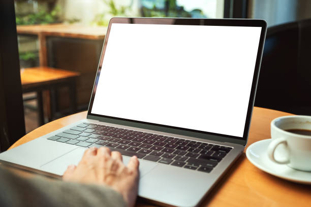 istock a woman using and touching on laptop touchpad with blank white desktop screen with coffee cup on the table 1210231080