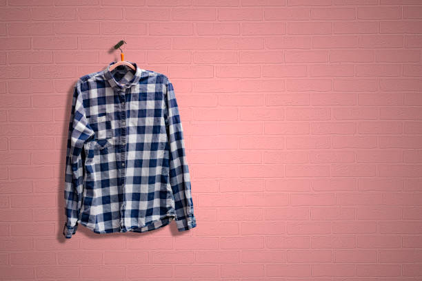 istock a simple checkered shirt on a hanger on a wall, minimalist abstract concept at home 1210232387
