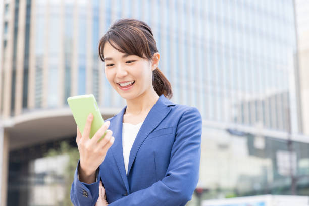istock asian woman who see a smart phone 1210232403