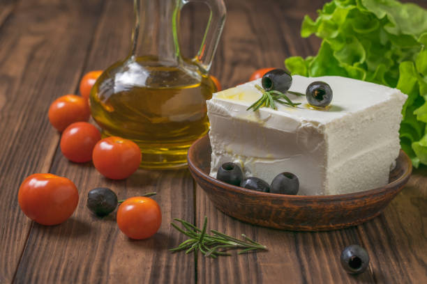istock Feta cheese and cherry tomatoes scattered on the table. 1210235245