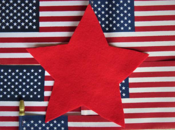 istock USA American flags covered with red felt star 1210235346