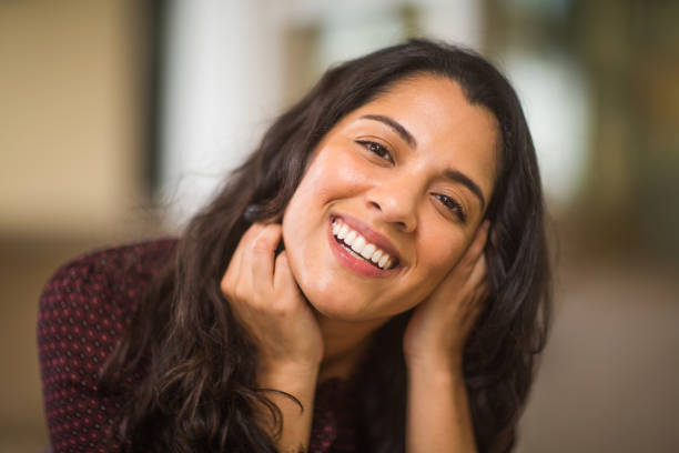 istock Young Hispanic woman smiling. 1210236292