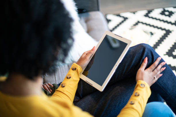 istock Woman Holding a Digital Tablet 1210236548