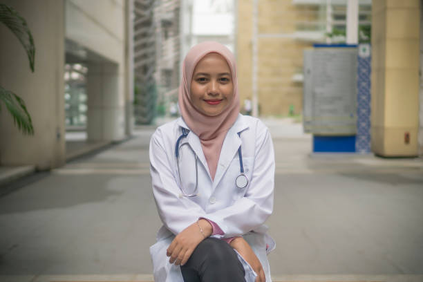 istock Medical Practitioner with stethoscope outdoor 1210245114