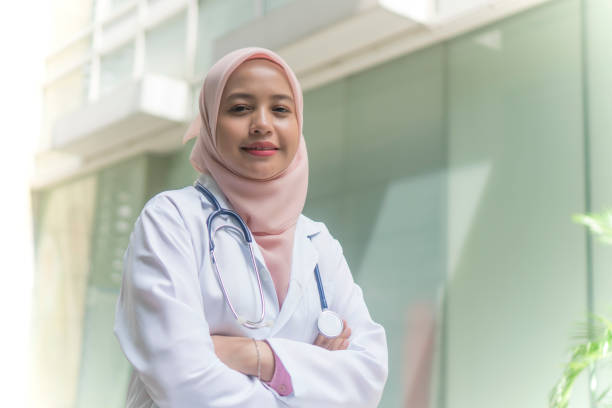 istock Medical Practitioner with stethoscope outdoor 1210245116