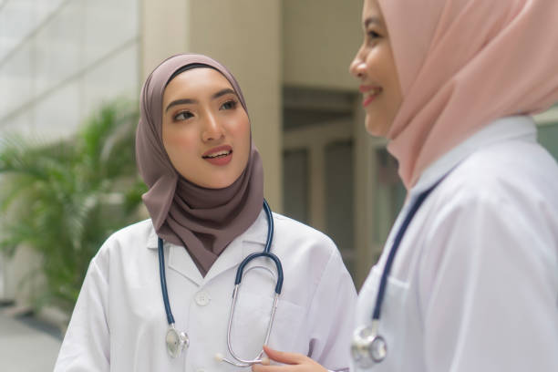 istock Medical Practitioner with stethoscope outdoor 1210245120