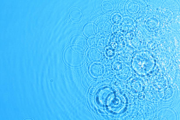 istock texture of splashing clean water on blue background 1210245151