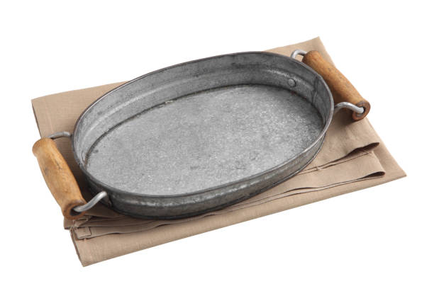 istock Empty metal tray and napkin isolated on white background 1210246028