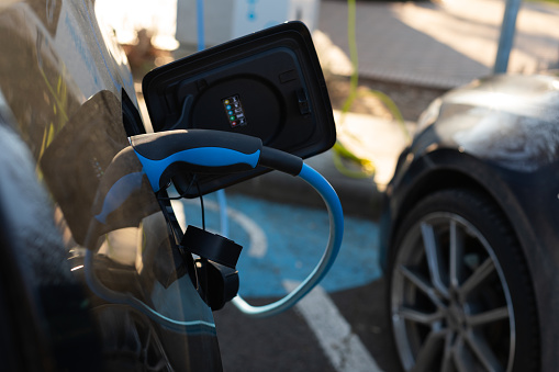 Electric car charging on parking lot in Gyula, Hungary