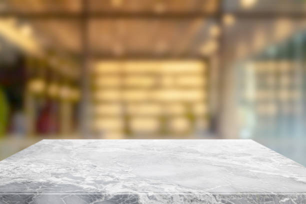 istock Empty white marble stone table top and blur glass window interior restaurant banner mock up abstract background - can used for display or montage your products. 1210251874