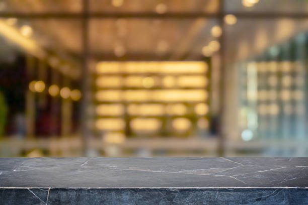 istock Empty black marble stone table top and blur glass window interior restaurant banner mock up abstract background - can used for display or montage your products. 1210251875