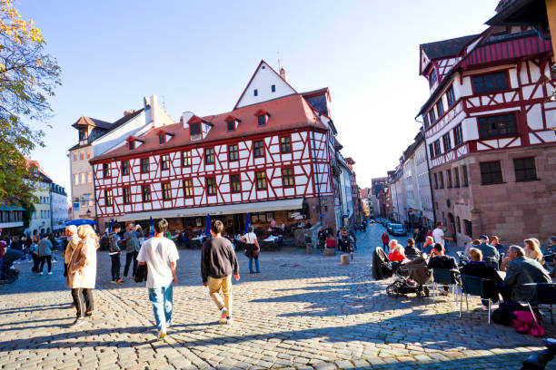 Nuremberg, Germany - October 2019 : People crowd at old town in Nuremberg, Bavaria, Germany.