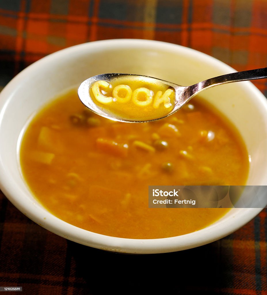 Cook spelled out on a soup spoon  Alphabet Soup Stock Photo